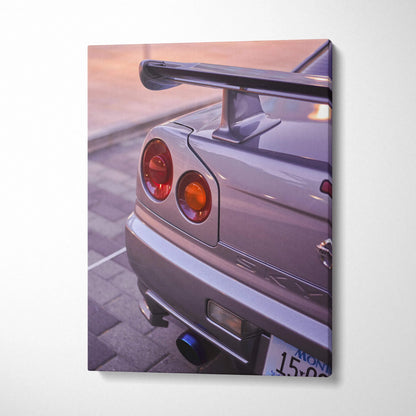 Vertical canvas wall art featuring a close-up of a silver Nissan GTR R34 Skyline tail light and spoiler at sunset.