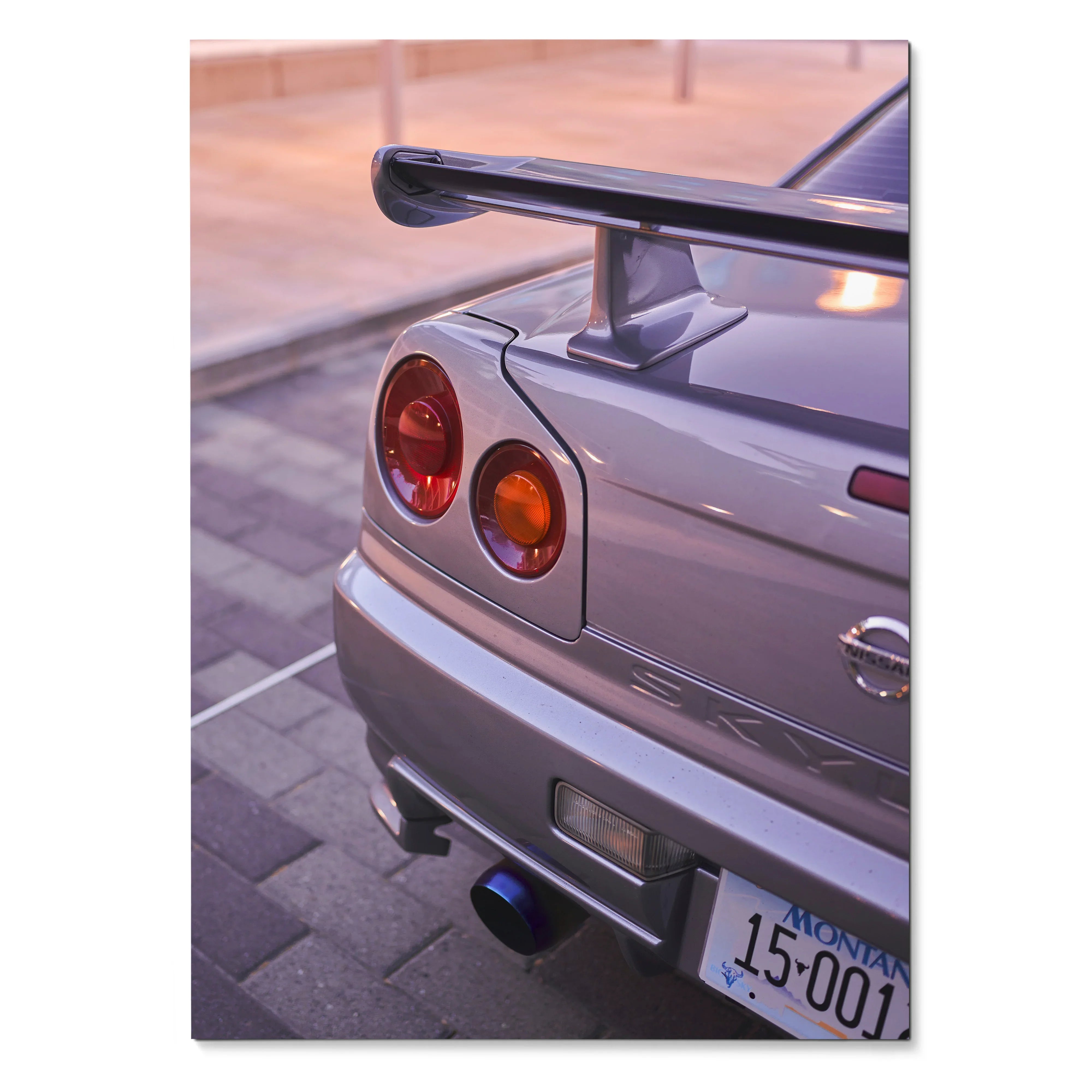 Close-up of silver Nissan R34 GTR rear with spoiler and taillights, automotive wall art poster.