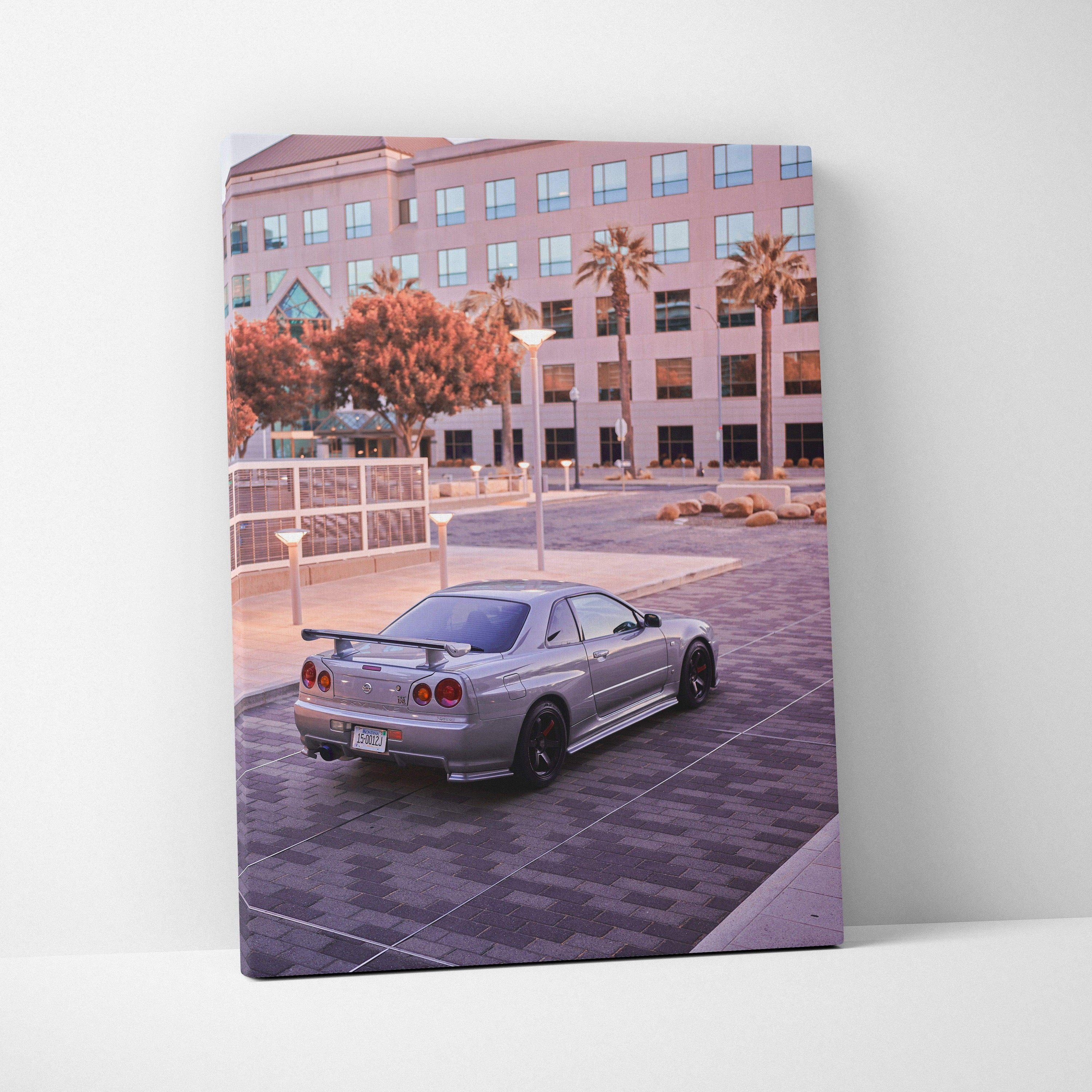 Nissan GTR R34 Skyline parked in urban setting canvas wall art with soft lighting and modern architecture background.
