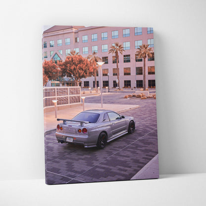 Nissan GTR R34 Skyline parked in urban setting canvas wall art with soft lighting and modern architecture background.
