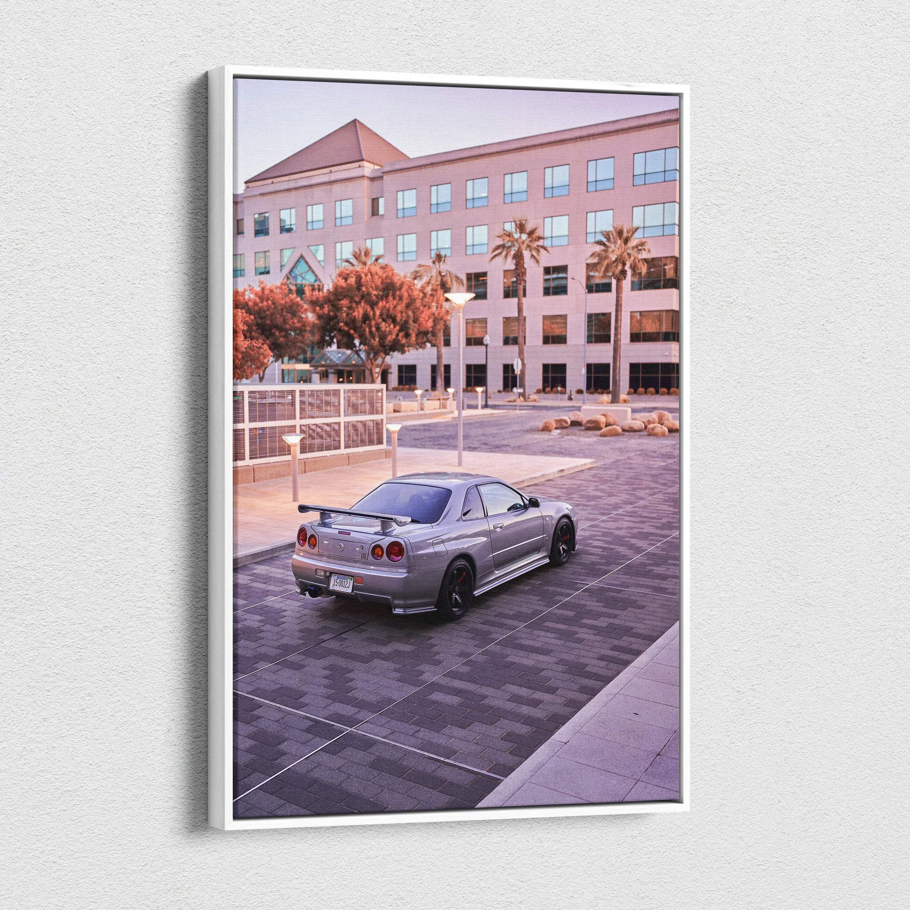 Nissan GTR R34 Skyline parked in front of office building canvas wall art in soft evening light.