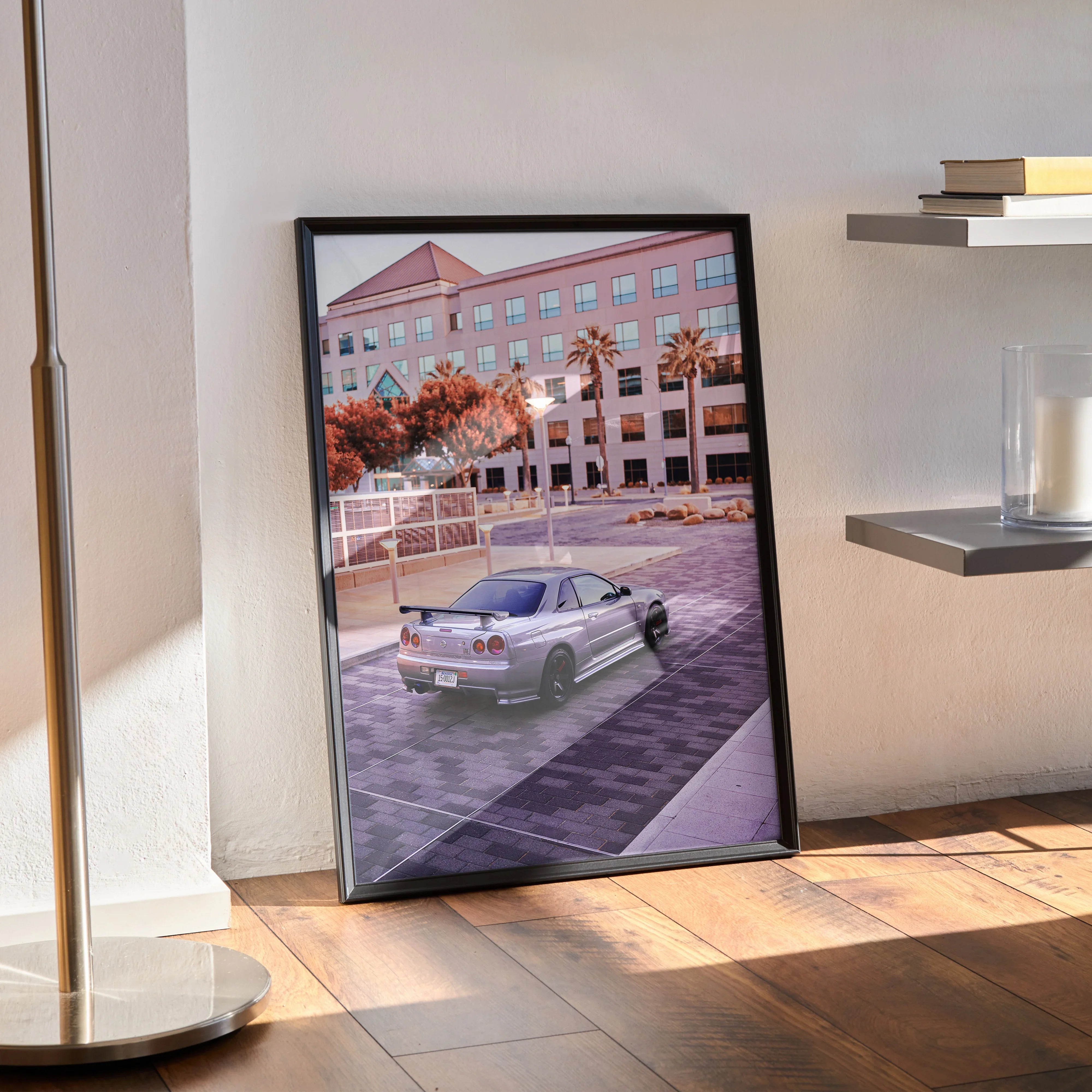 Nissan R34 GTR poster with sunset cityscape and palm trees in black frame wall art.