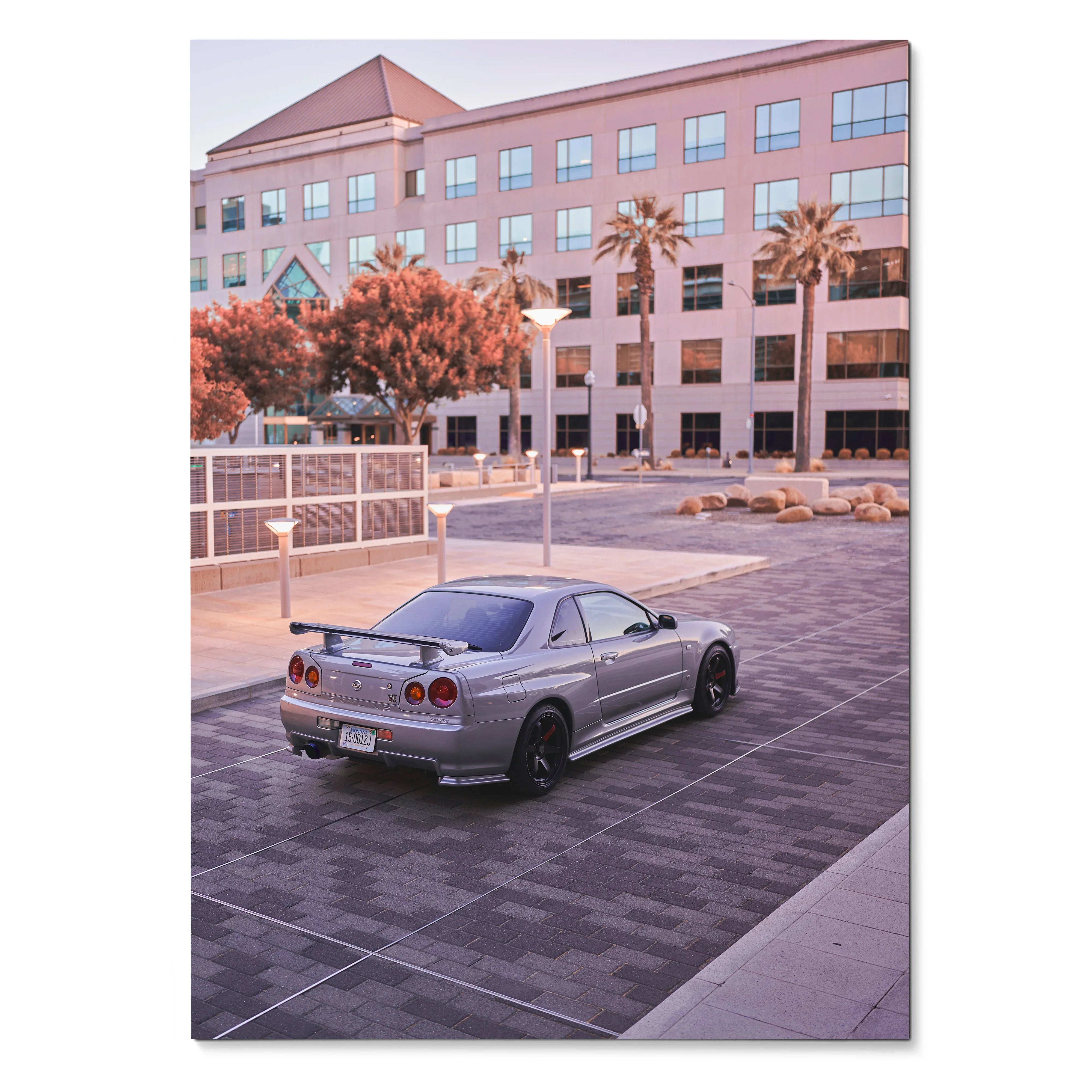 Nissan R34 GTR silver sports car parked near modern office building poster wall art.