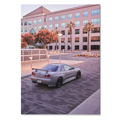 Nissan R34 GTR silver sports car parked near modern office building poster wall art.