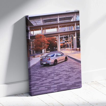 Nissan GTR R34 Skyline on urban street canvas wall art with modern architecture background.