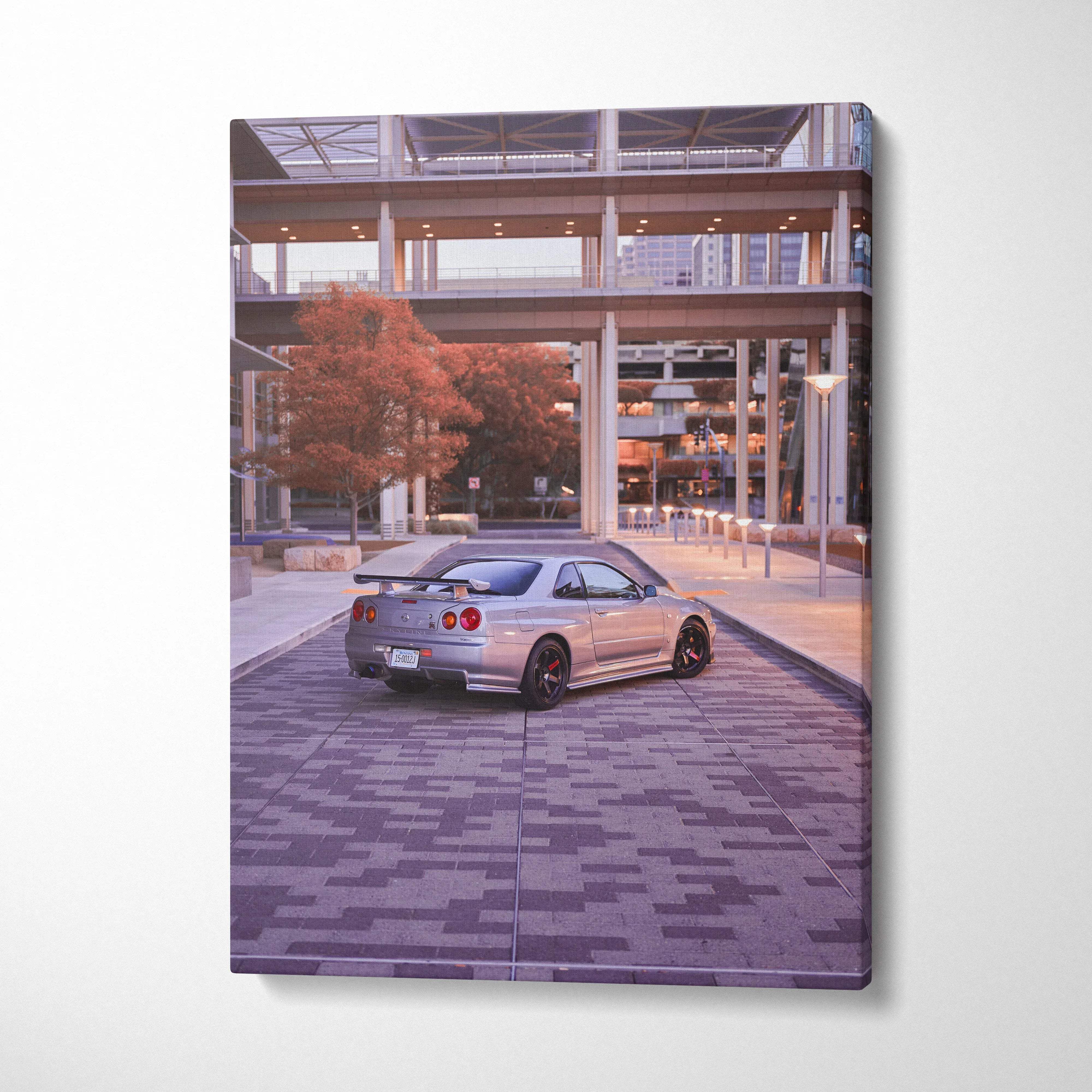 Nissan GTR R34 Skyline printed on vertical canvas wall art with urban cityscape background.