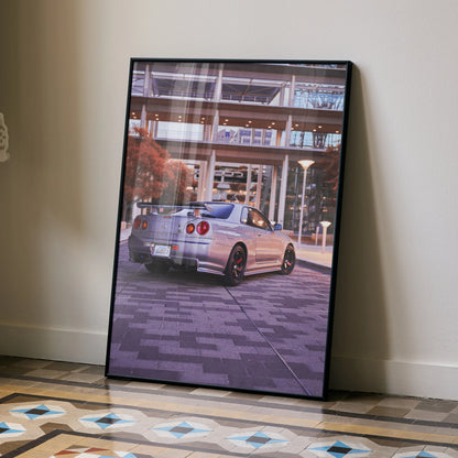 Nissan R34 GTR poster featuring rear view of silver sports car in urban setting, framed wall art.
