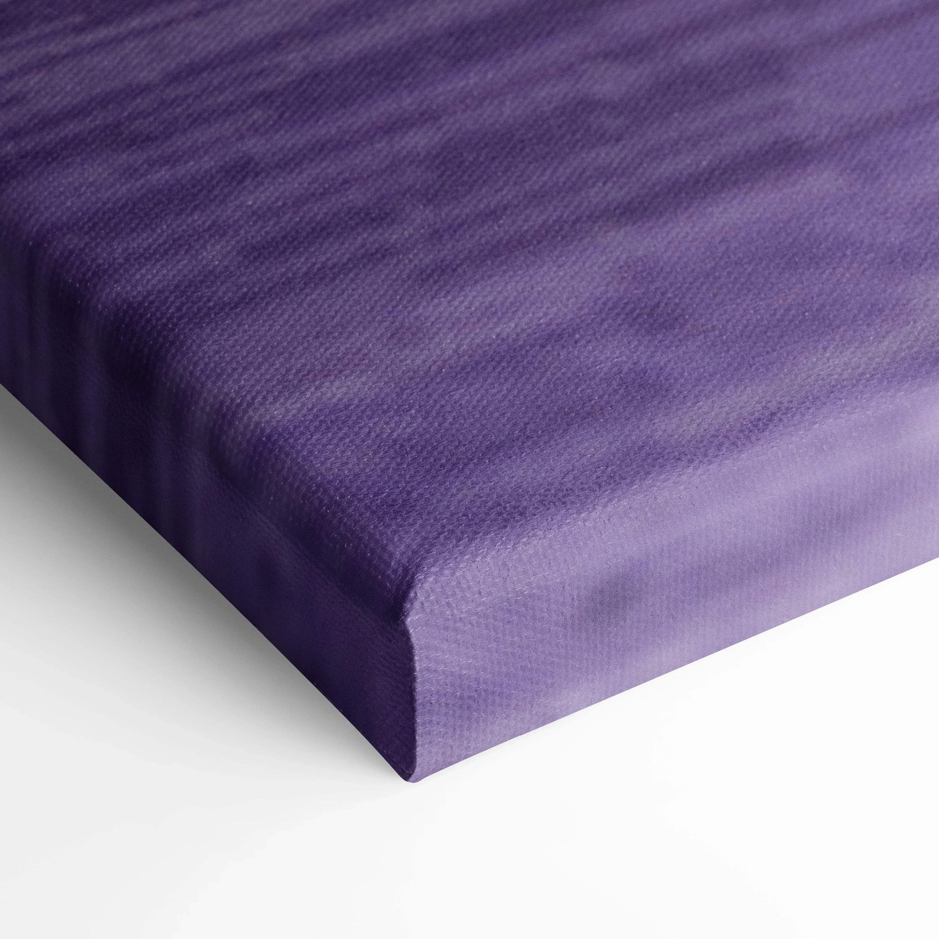 Close-up of purple textured canvas art with tight, museum-quality wrapped edges for vertical wall art display.