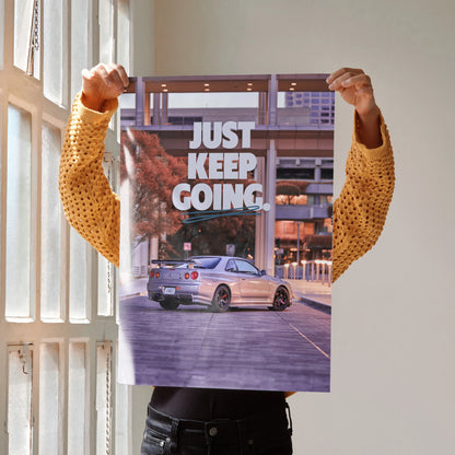 Nissan GT-R R34 Skyline poster with urban background and "Just Keep Going" motivational text wall art.