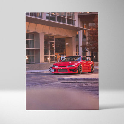 Vertical canvas art featuring a red Nissan 240sx S14 Kouki parked in front of modern architecture wall art.