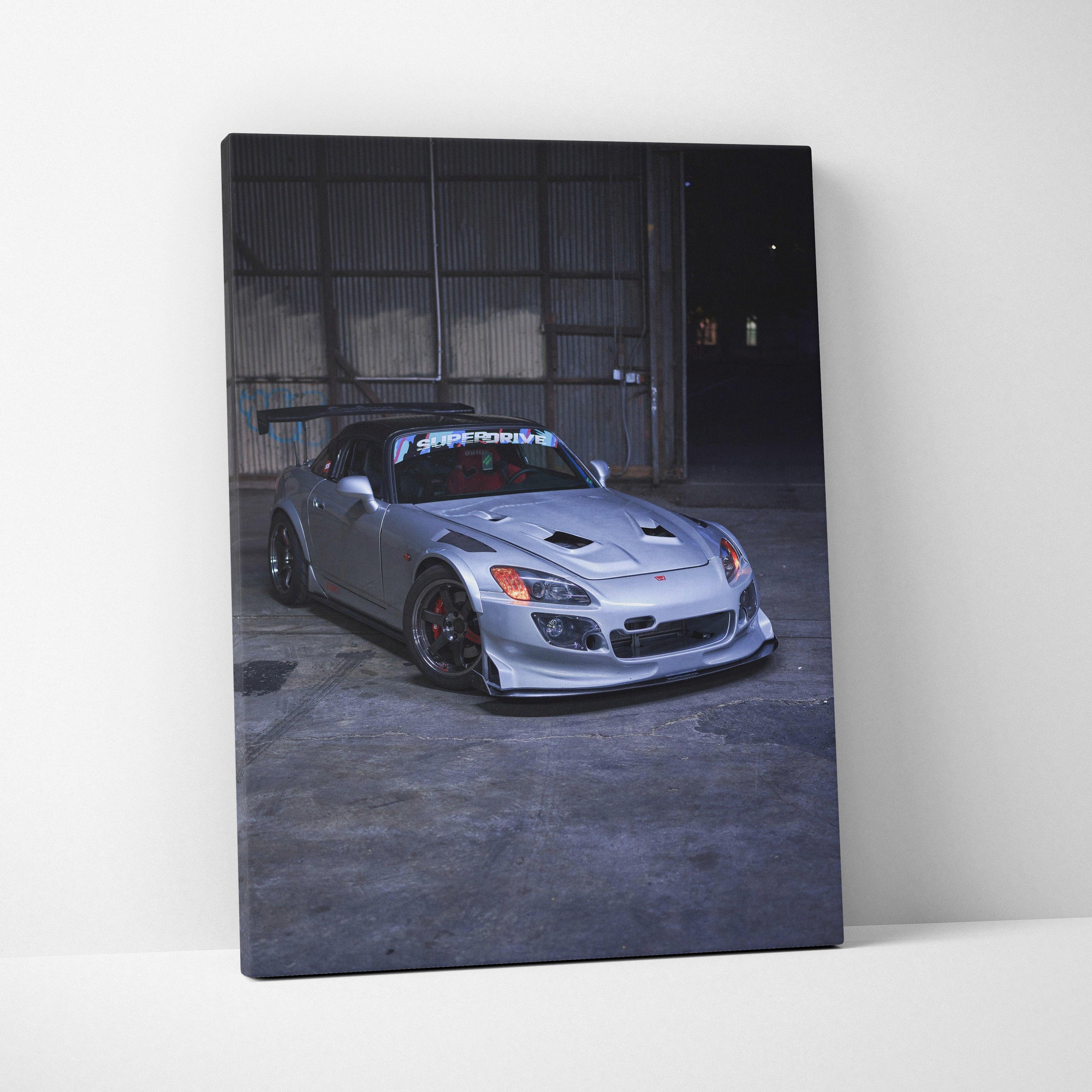 Honda S2000 sleek silver sports car canvas wall art with dark industrial background.