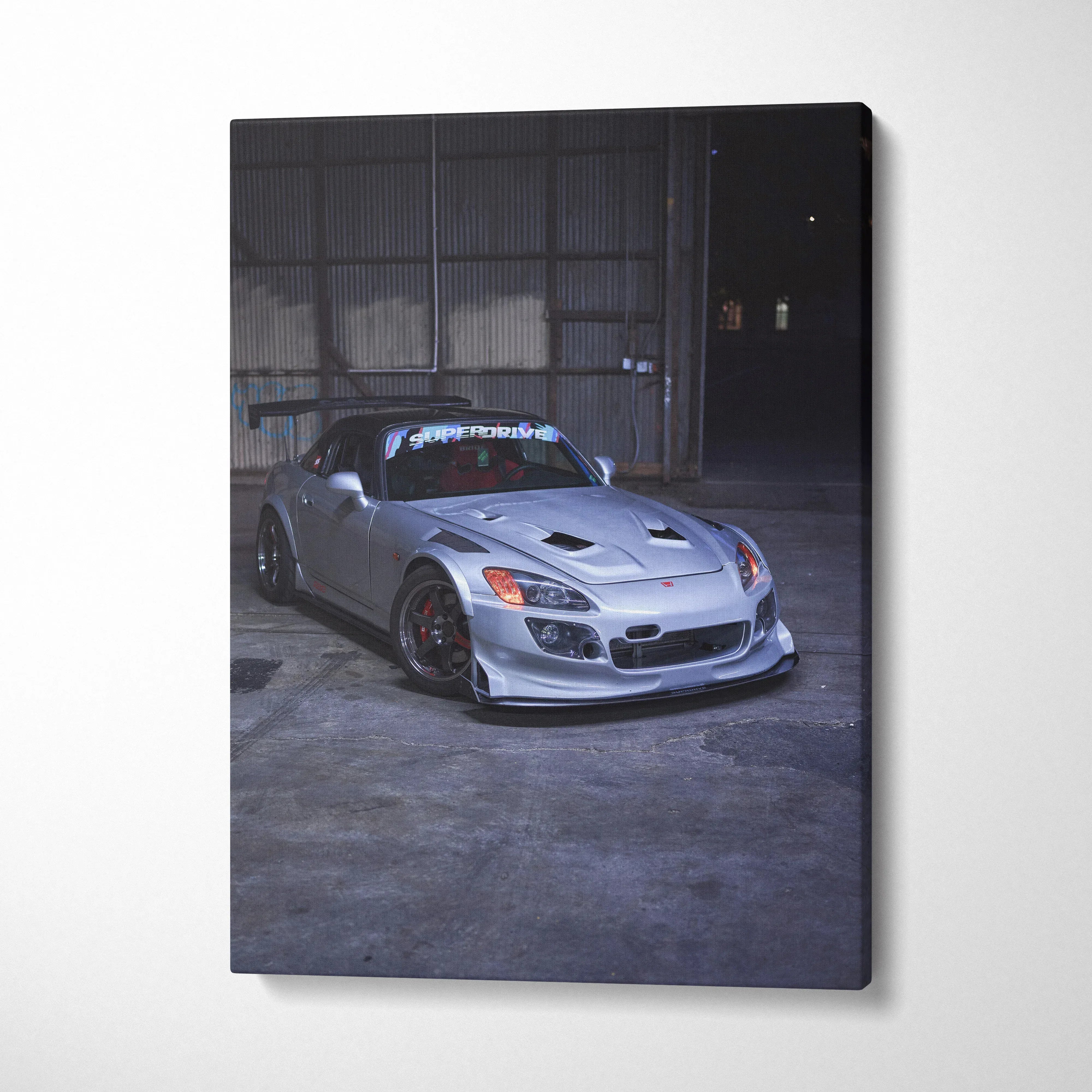 Honda S2000 car canvas wall art featuring a silver sports car in a dark industrial setting.