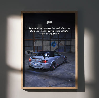 Motivational poster wall art featuring silver Honda S2000 in a dim industrial garage with inspiring text.