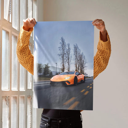 Lamborghini Huracan orange sports car on road with trees background poster wall art.