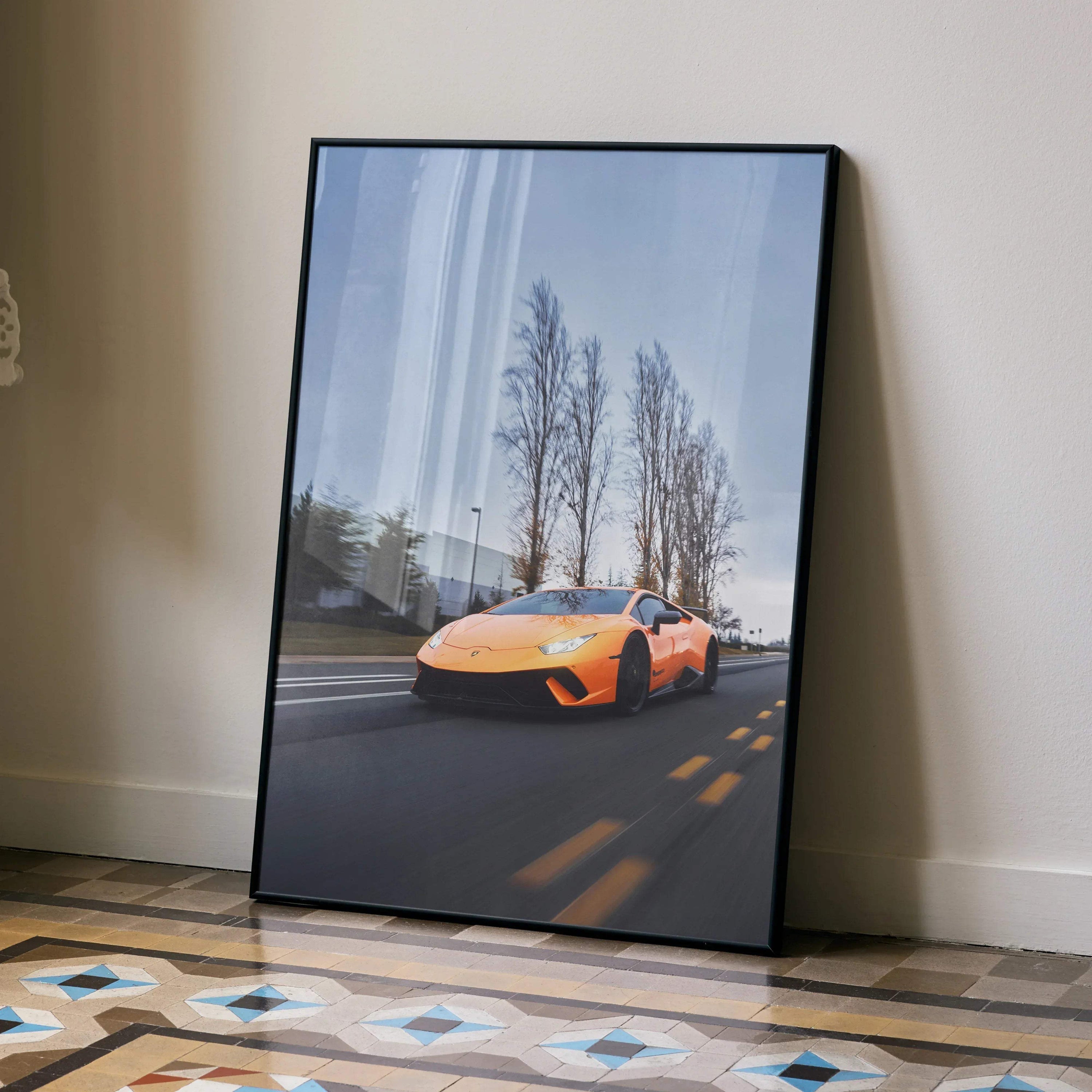 Lamborghini Huracan orange sports car poster leaning on floor, premium wall art with trees background.