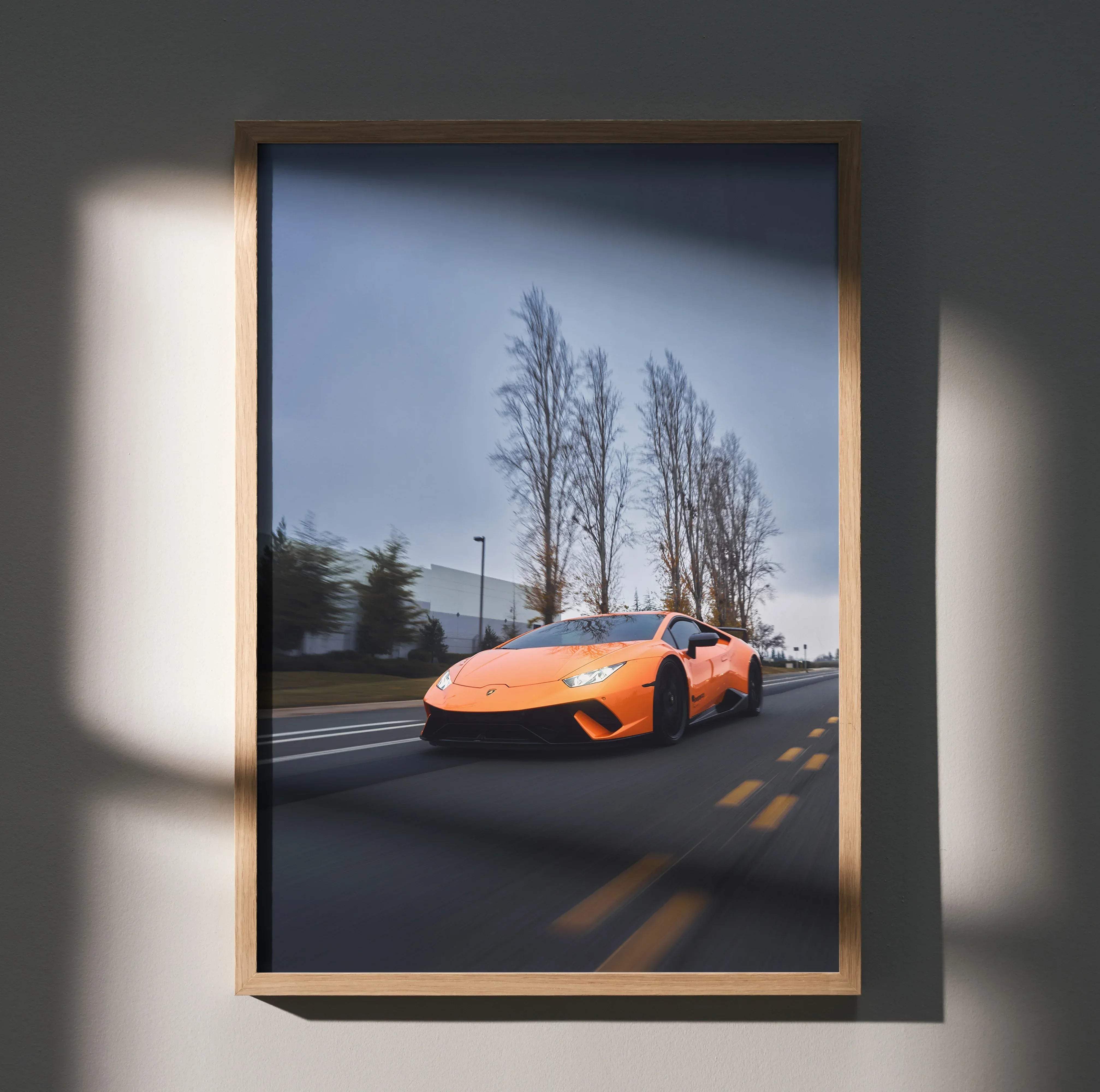 Framed high resolution premium wall art of an orange Lamborghini Huracan sports car for car enthusiasts