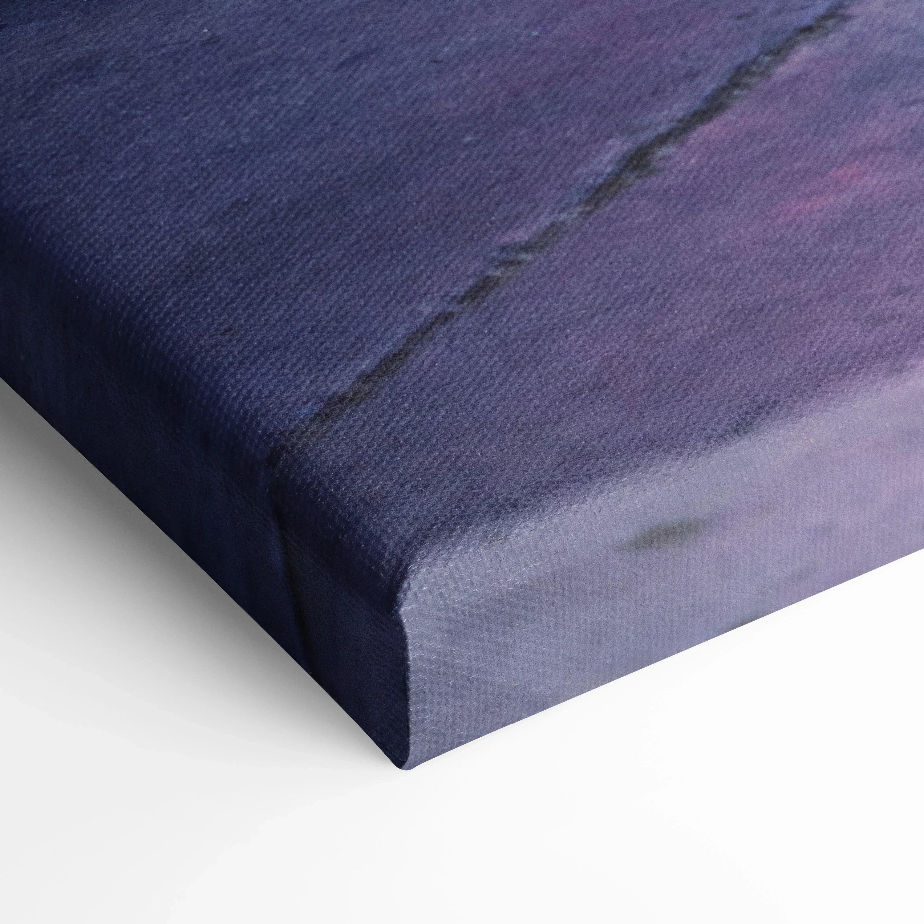 Close-up of museum-quality canvas print edge with visible textured fabric and vibrant blue and purple tones, vertical wall.