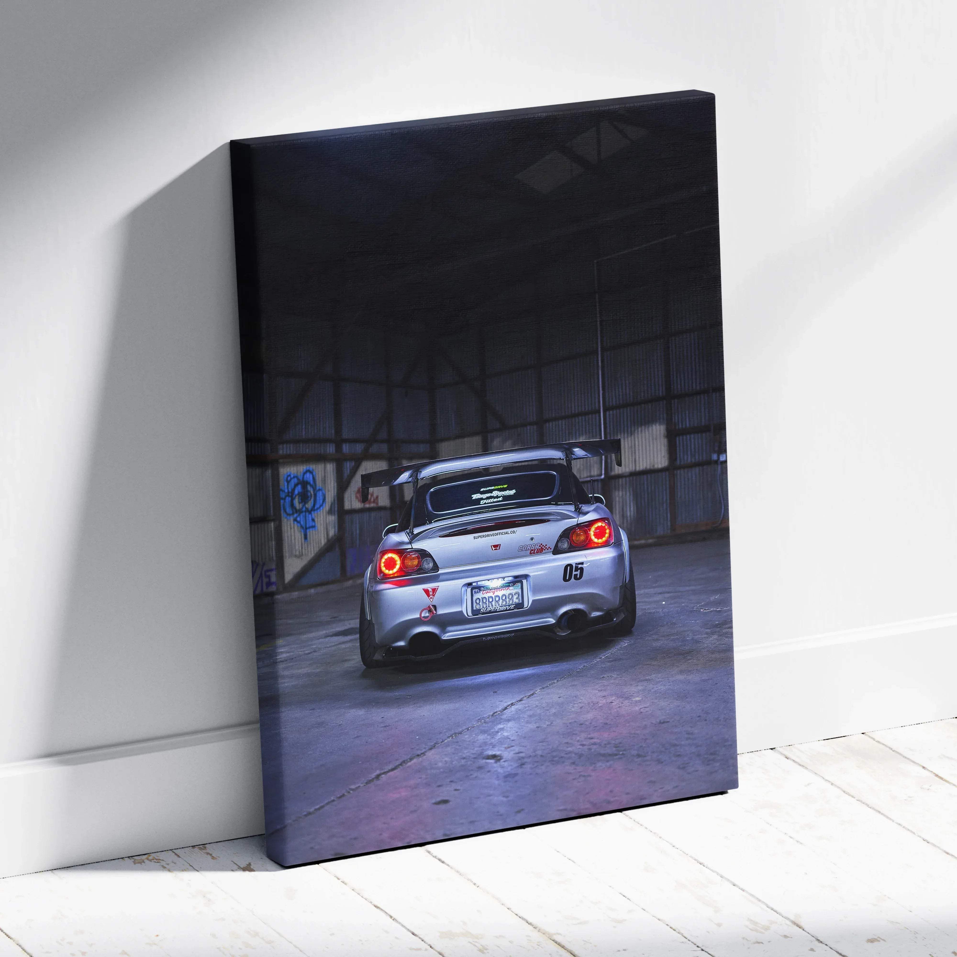 Canvas wall art featuring a high resolution vertical print of a silver honda s2000 sports car rear with glowing red taillights and spoiler