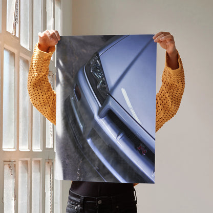 Nissan R34 GTR Skyline close-up poster showing front headlight and grille wall art.