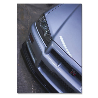 Nissan R34 GTR Skyline close-up poster showing silver front bumper and headlight wall art.