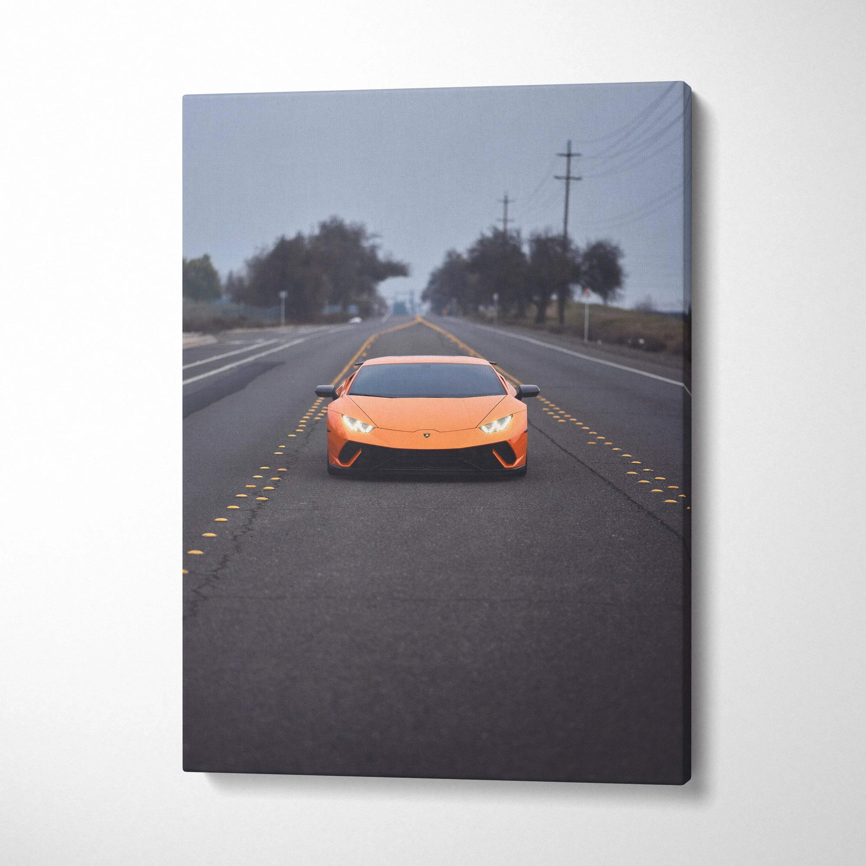 Orange Lamborghini Huracan on empty road canvas wall art vertical print.