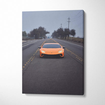 Orange Lamborghini Huracan on empty road canvas wall art vertical print.