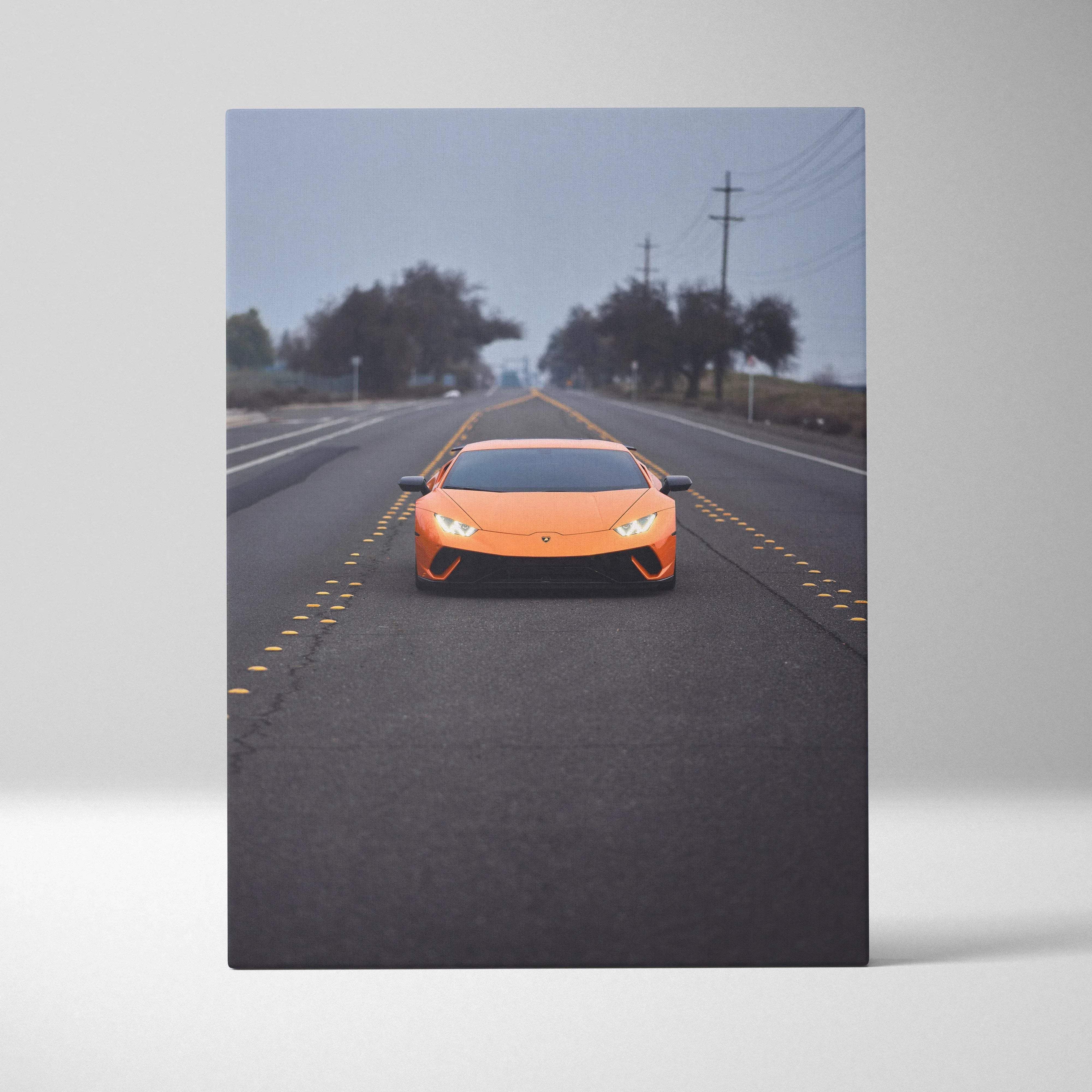 Vibrant orange Lamborghini Huracan sports car with sleek design and glowing headlights on misty road vertical canvas print