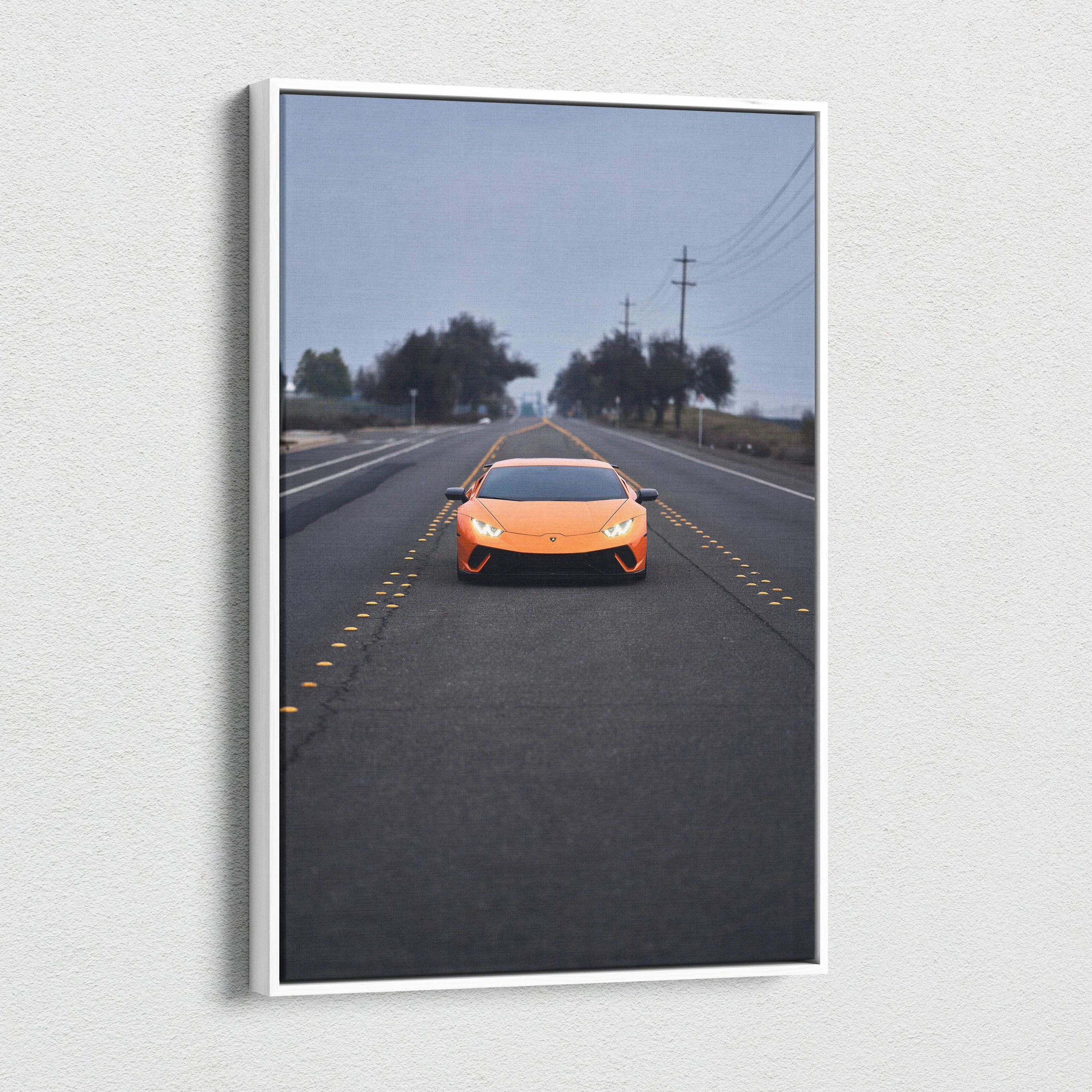Orange Lamborghini Huracan on road under cloudy sky canvas wall art vertical print.