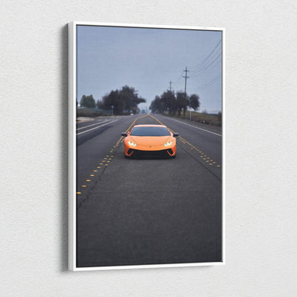 Orange Lamborghini Huracan on road under cloudy sky canvas wall art vertical print.
