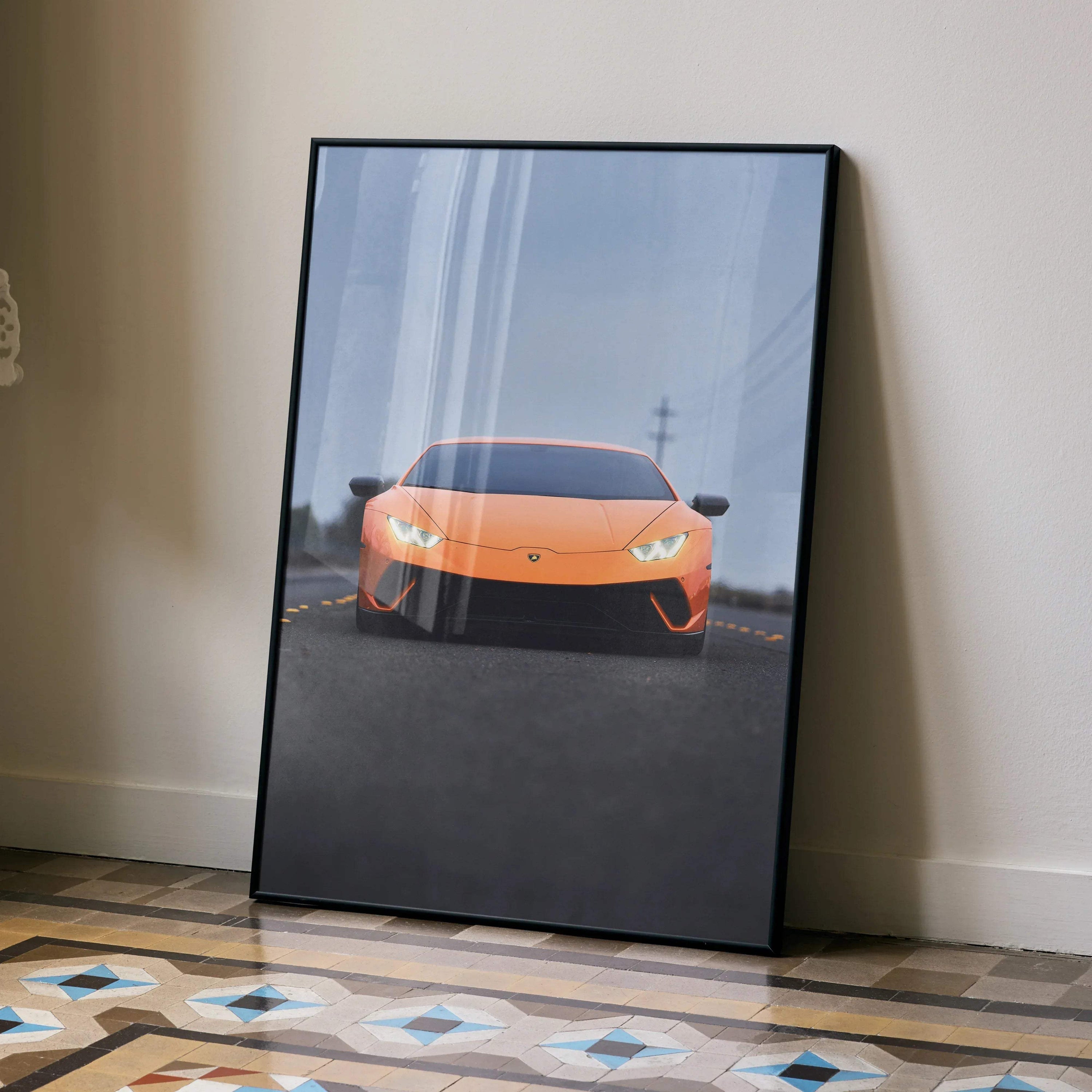 Lamborghini Huracan poster with vibrant orange sports car on road, modern wall art with black frame.