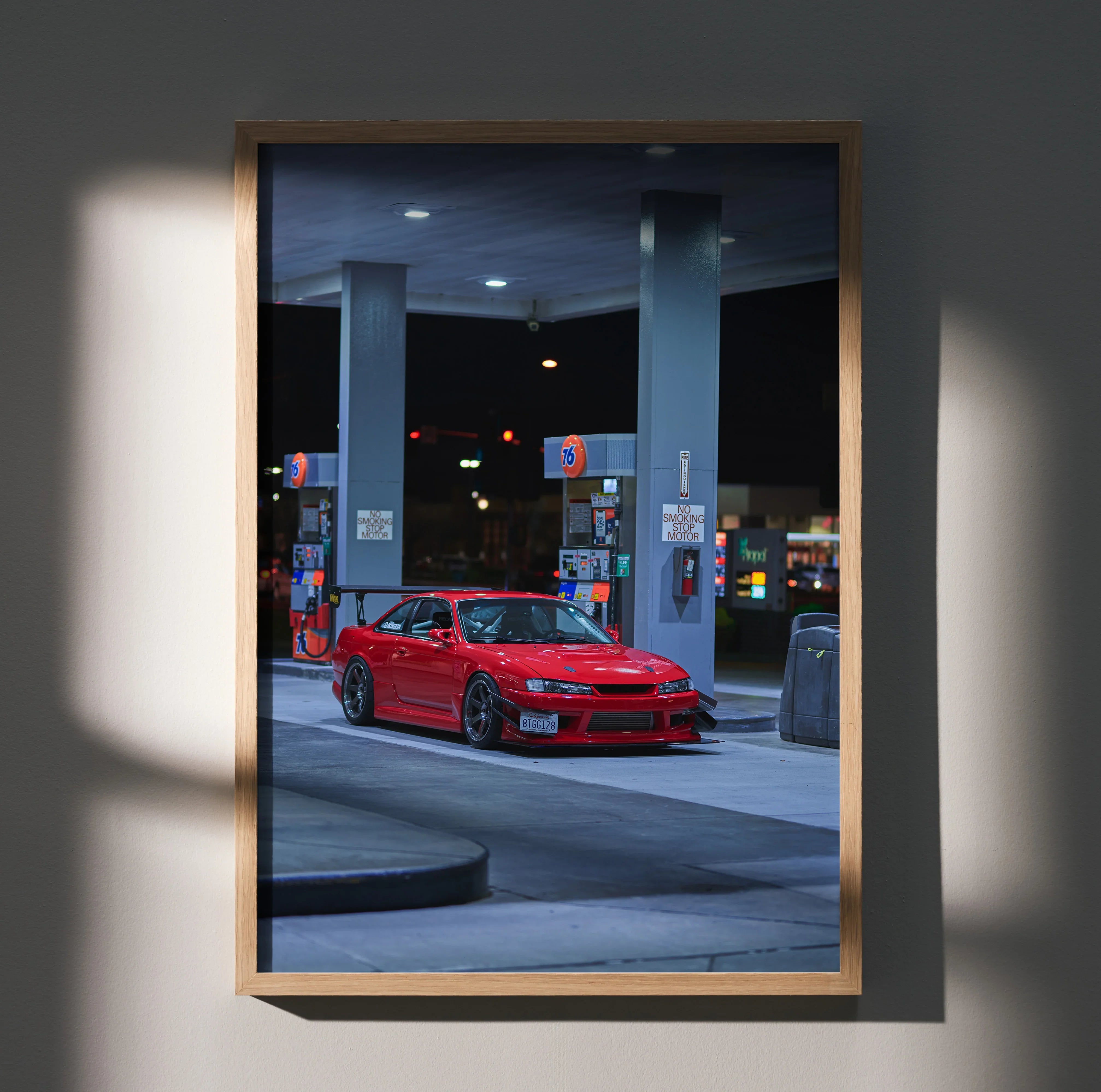 Red Nissan 240SX S14 Kouki parked at gas station at night poster wall art.