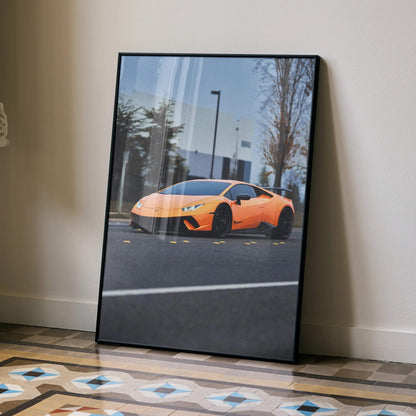 Lamborghini Huracan orange sports car poster leaning on wall, modern automotive wall art.