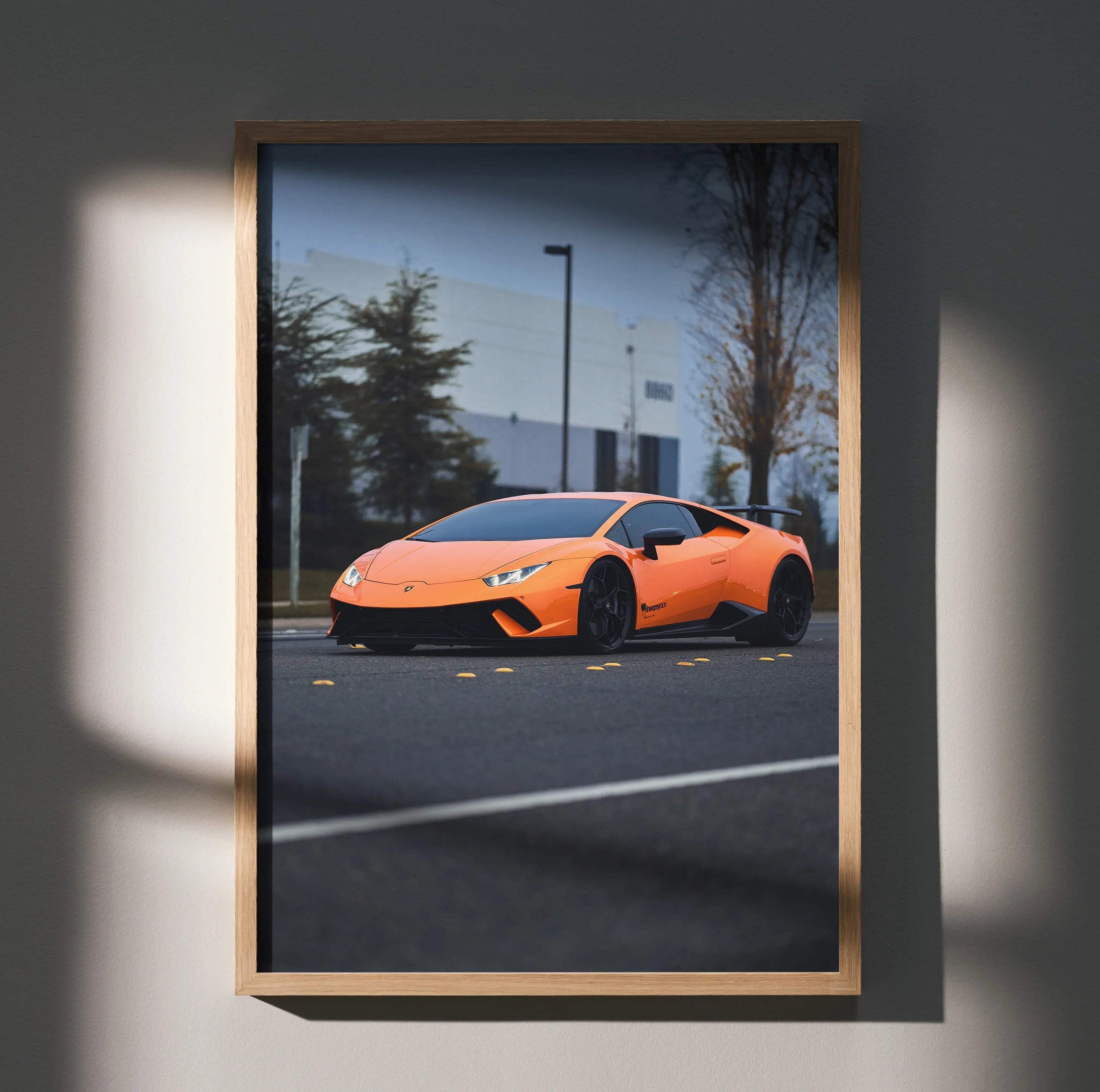 Orange Lamborghini Huracan poster in sleek wooden frame with urban background wall art.