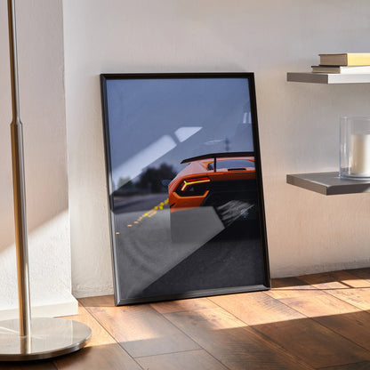 Lamborghini Huracan rear view poster with orange sports car and blurred motion wall art in black frame.
