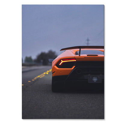 Orange Lamborghini Huracan rear view on road at dusk poster wall art.