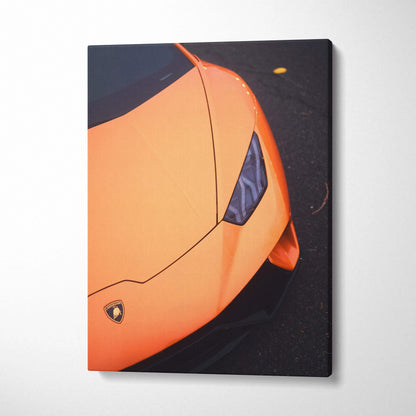 Orange Lamborghini Huracan close-up on vertical canvas wall art with high-resolution details and sleek design.