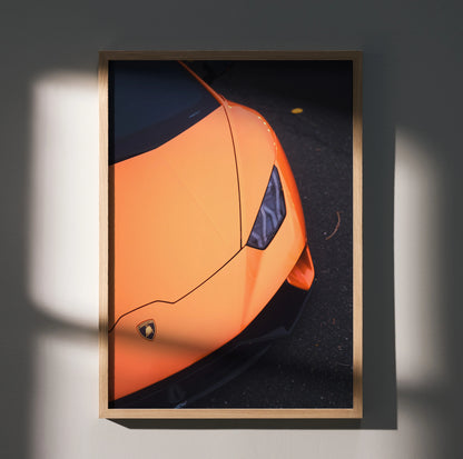 Orange Lamborghini Huracan close-up poster with sleek headlight detail in wooden frame wall art.
