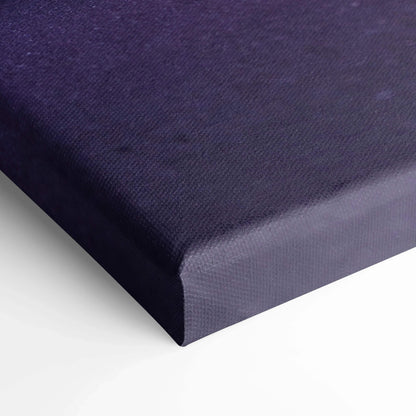 Close-up of dark navy blue gallery-wrapped canvas wall art with textured surface.