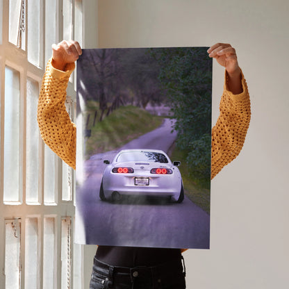 Toyota Supra MK4 driving on winding road poster wall art with vibrant colors.