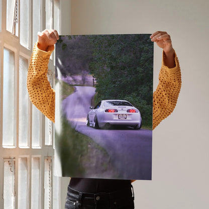 Toyota Supra MK4 poster wall art featuring a rear view on a winding road in high resolution.