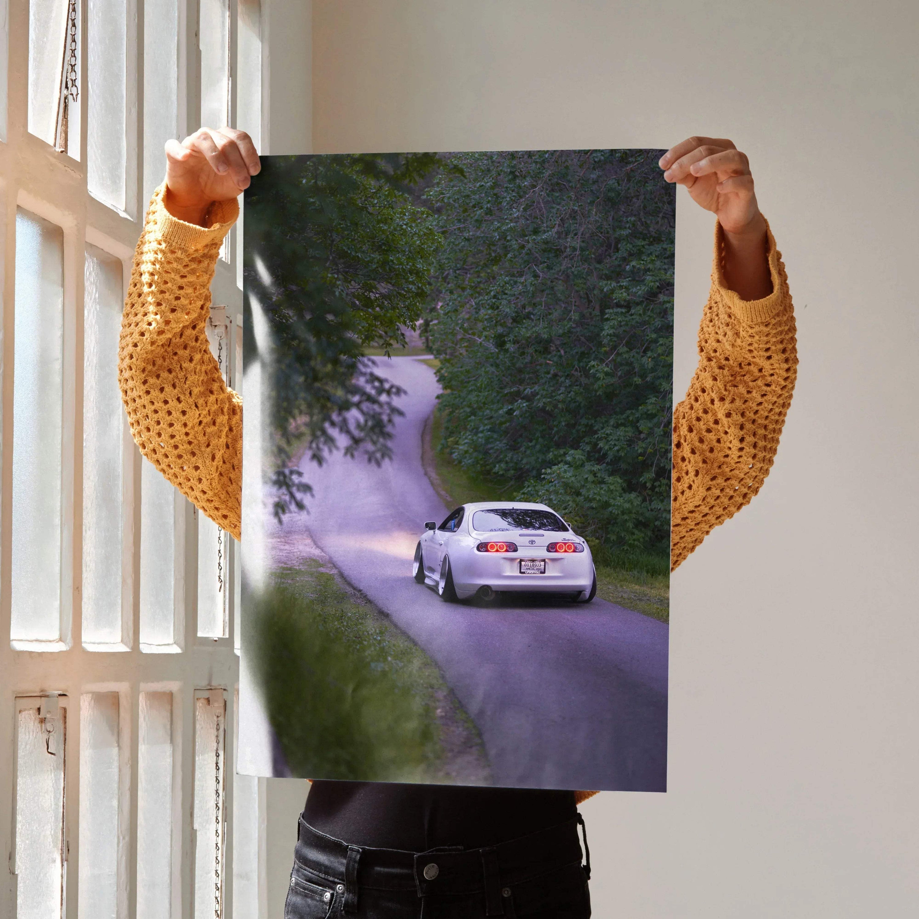 Toyota Supra MK4 driving on forest road poster wall art in vibrant colors.