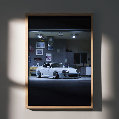 Toyota Supra MK4 white sports car poster in a framed wall art with garage background.