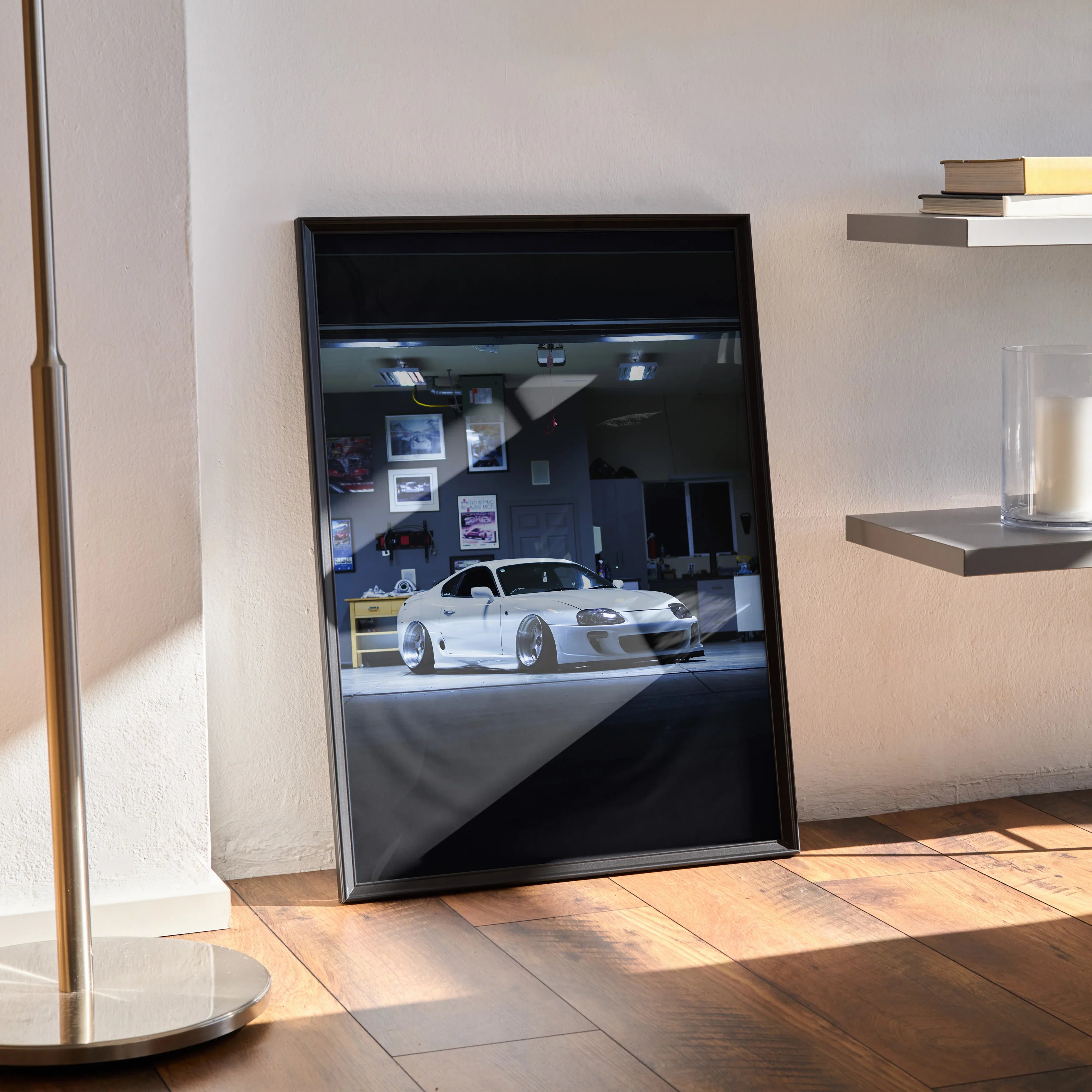 Toyota Supra MK4 poster wall art featuring a white iconic car in a dark showroom setting.