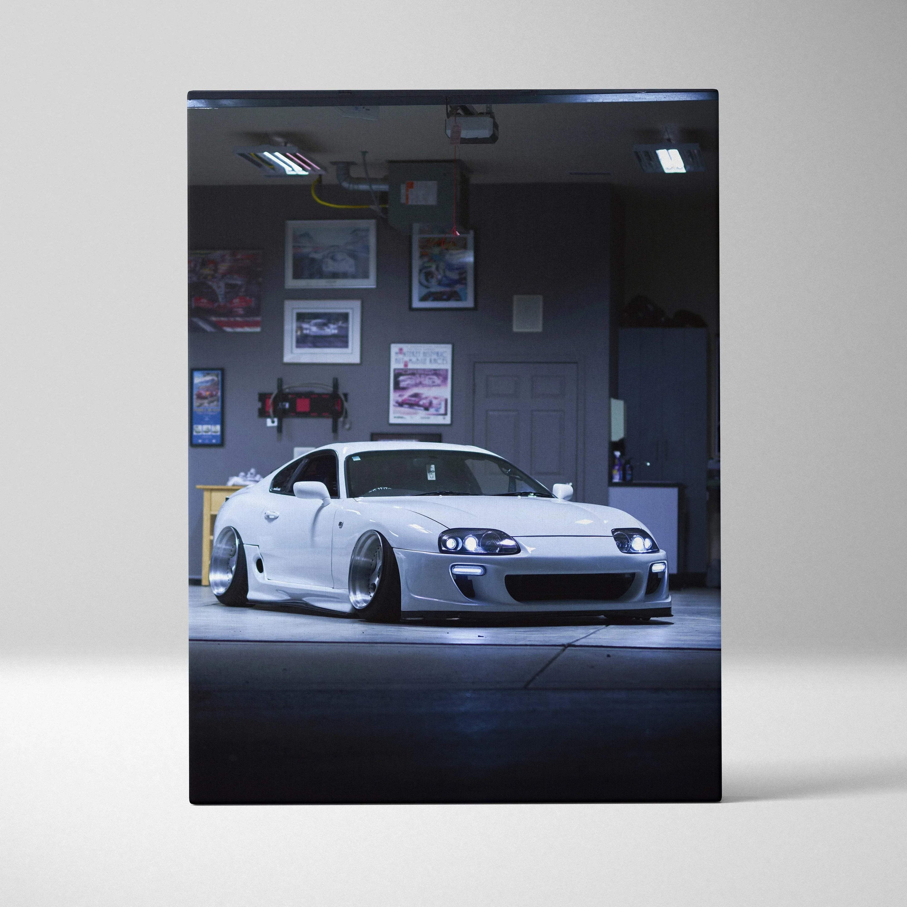 Vertical canvas art featuring a white Toyota Supra MK4 in a garage setting, high-resolution wall art.