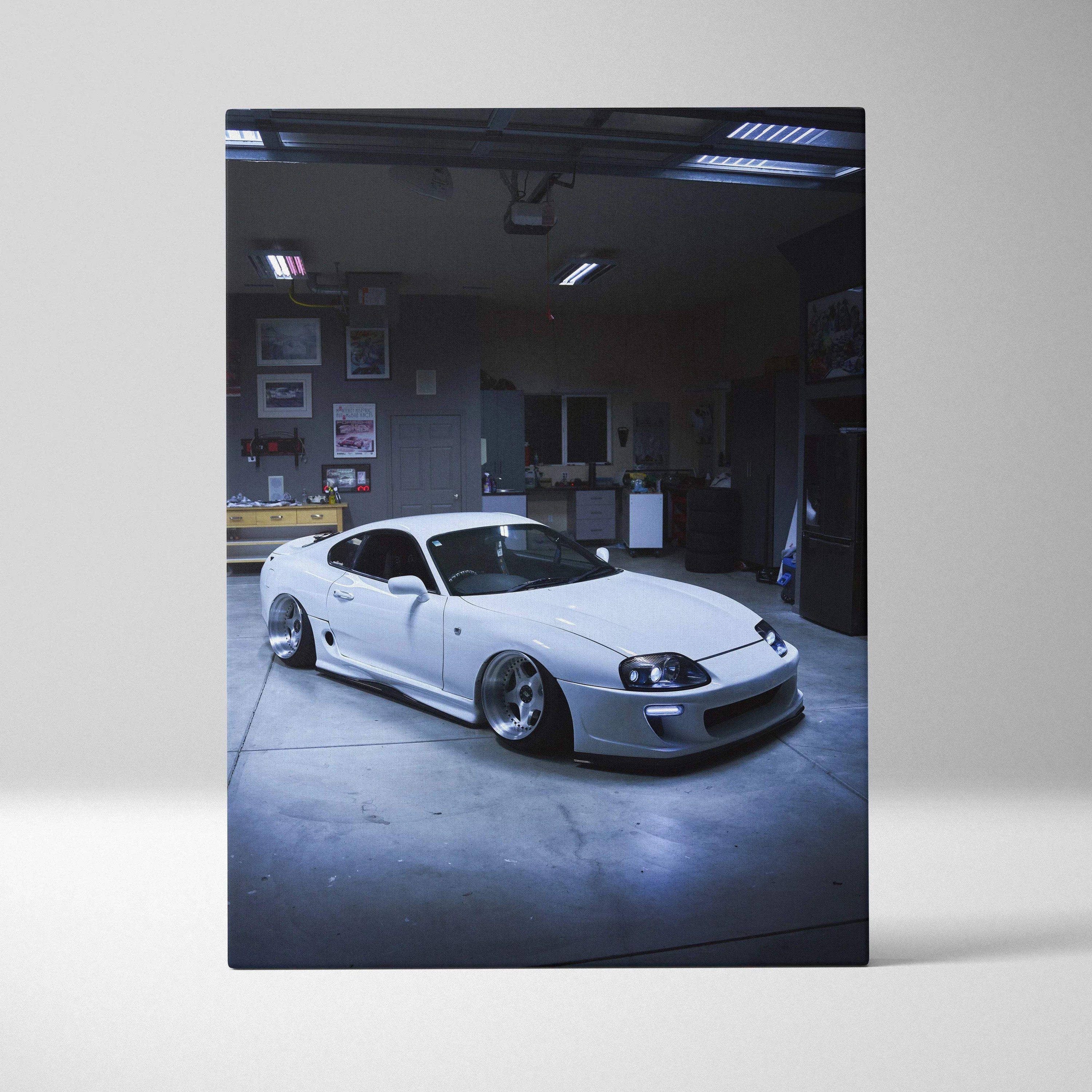White Toyota Supra MK4 parked indoors in high-resolution vertical canvas art print for wall art decor.