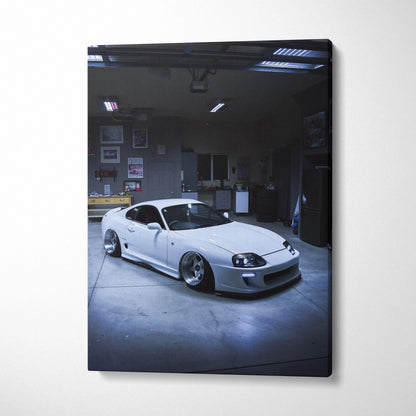 Toyota Supra MK4 white sports car in dimly lit garage canvas wall art print.