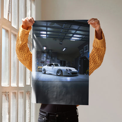 Toyota Supra MK4 car in a garage setting, glossy poster wall art with sleek white sports car and reflective floor.