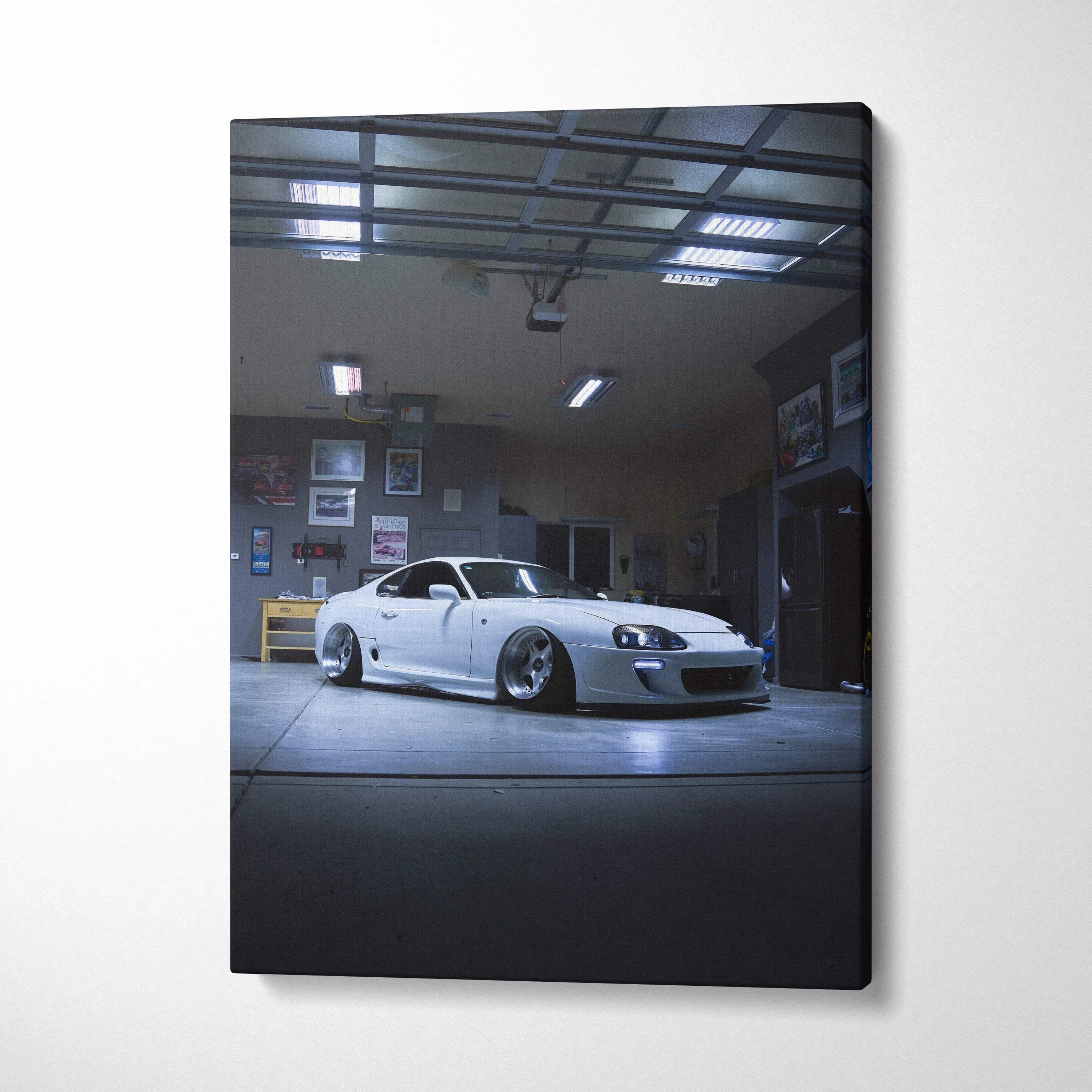Vertical canvas art of a white Toyota Supra MK4 in a dimly lit garage, wall art decor.