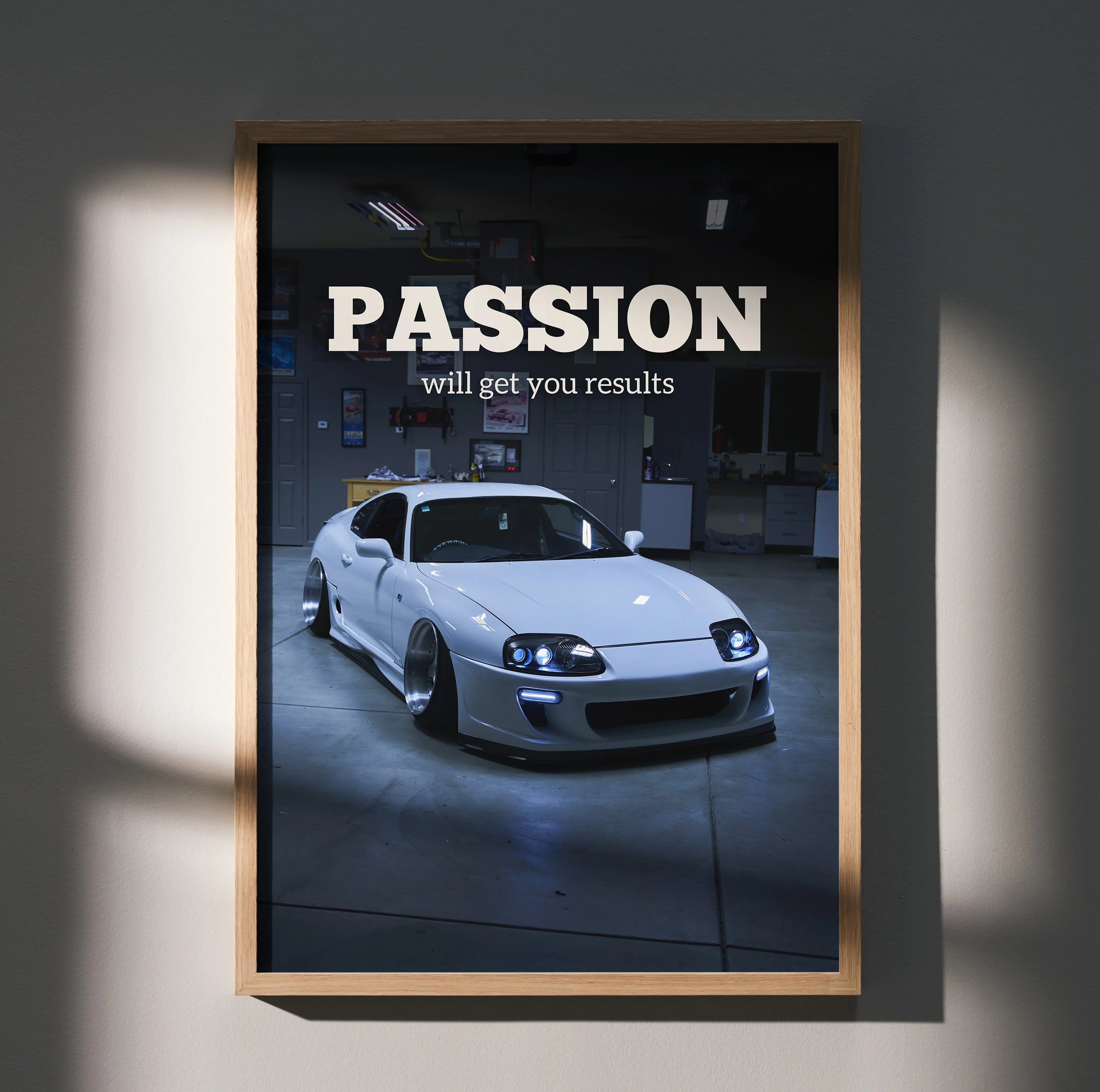 Motivational poster wall art featuring white Toyota Supra Mk4 with "Passion will get you results" text on black background.