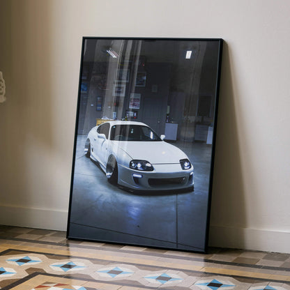 Toyota Supra MK4 poster featuring a white Supra in a dimly lit garage, wall art with a sleek automotive design.